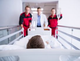 doctors-pushing-emergency-stretcher-bed-corridor_107420-63717