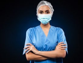 serious-doctor-medical-mask-cap-looking_171337-5807